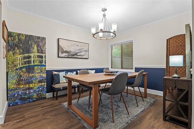 111 Crown Oaks Way Unit 101, Longwood, FL 32779 - dining area with a chandelier, crown molding, dark wood-style flooring, baseboards, and a wainscoted wall
