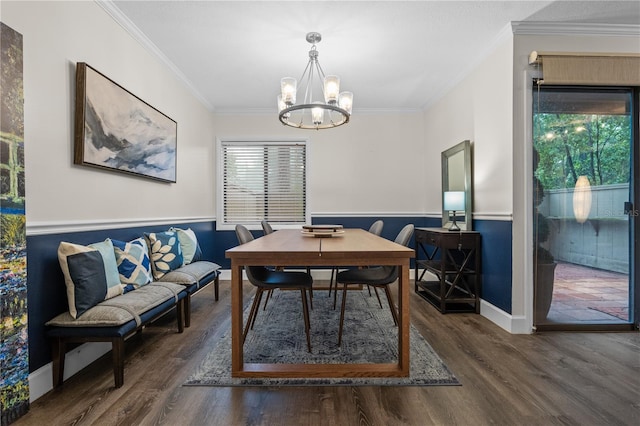 111 Crown Oaks Way Unit 101, Longwood, FL 32779 - dining room with wood finished floors, crown molding, a chandelier, and wainscoting