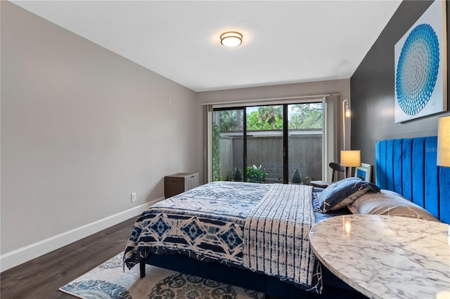 111 Crown Oaks Way Unit 101, Longwood, FL 32779 - bedroom with baseboards and wood finished floors