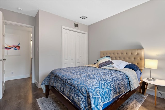 111 Crown Oaks Way Unit 101, Longwood, FL 32779 - bedroom featuring a closet, wood finished floors, and baseboards