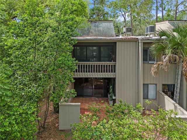 111 Crown Oaks Way Unit 101, Longwood, FL 32779 - rear view of house with cooling unit