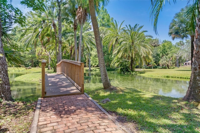 111 Crown Oaks Way Unit 101, Longwood, FL 32779 - surrounding community with a water view and a yard