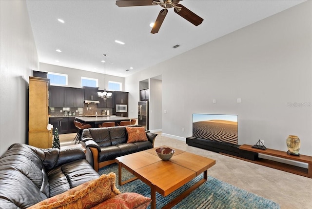 13865 Granger Ave, Orlando, FL 32827 - living room with baseboards, ceiling fan with notable chandelier, recessed lighting, and visible vents