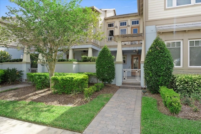 13865 Granger Ave, Orlando, FL 32827 - view of front facade featuring fence, a gate, and stucco siding