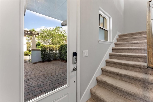 13865 Granger Ave, Orlando, FL 32827 - entryway featuring brick floor and stairway