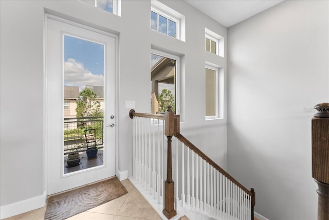 13865 Granger Ave, Orlando, FL 32827 - doorway with baseboards and tile patterned flooring