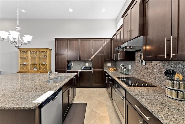 13865 Granger Ave, Orlando, FL 32827 - kitchen with backsplash, appliances with stainless steel finishes, light stone countertops, a sink, and under cabinet range hood