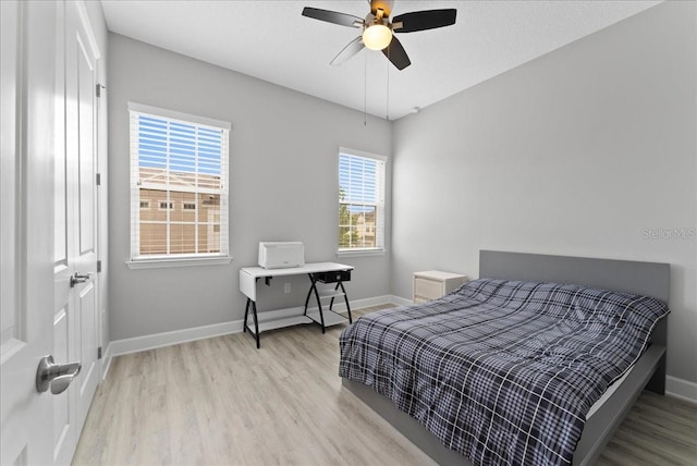 13865 Granger Ave, Orlando, FL 32827 - bedroom with baseboards, ceiling fan, and light wood finished floors