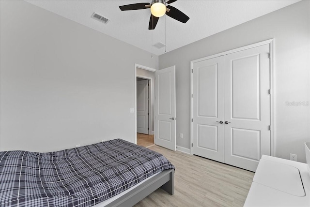 13865 Granger Ave, Orlando, FL 32827 - bedroom with visible vents, ceiling fan, a closet, and light wood-type flooring