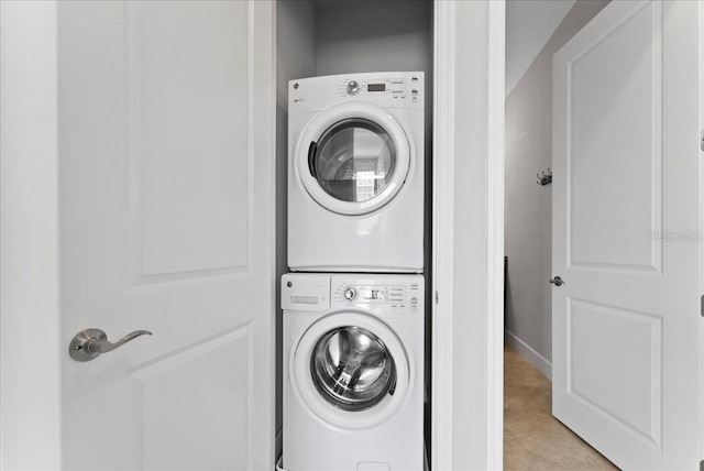 13865 Granger Ave, Orlando, FL 32827 - laundry area featuring laundry area, stacked washer and clothes dryer, and baseboards