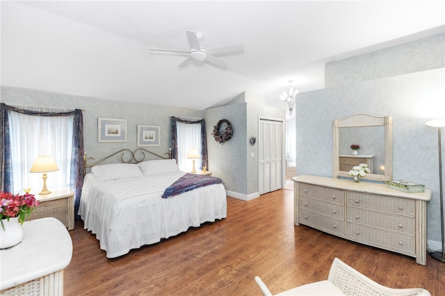 603 Yorkshire Dr, Oviedo, FL 32765 - bedroom featuring wallpapered walls, lofted ceiling, dark wood-style flooring, a closet, and ceiling fan