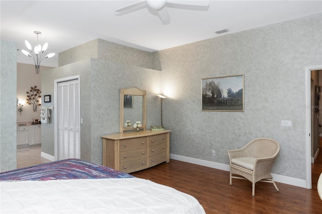 603 Yorkshire Dr, Oviedo, FL 32765 - bedroom with wood finished floors, connected bathroom, baseboards, and a closet