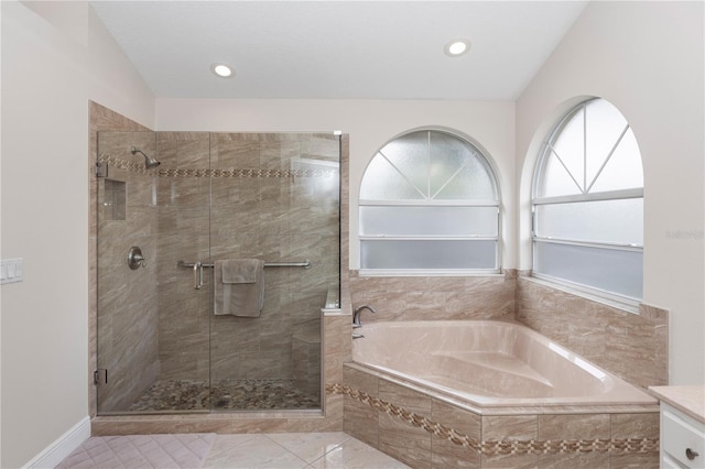 603 Yorkshire Dr, Oviedo, FL 32765 - bathroom with a stall shower, a bath, tile patterned flooring, and recessed lighting