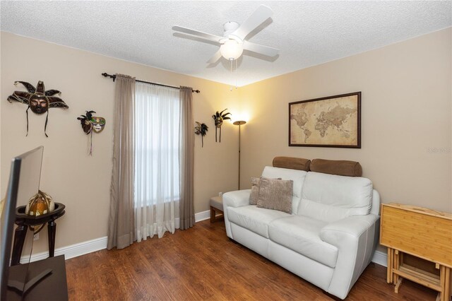 603 Yorkshire Dr, Oviedo, FL 32765 - living room with ceiling fan, baseboards, wood finished floors, and a textured ceiling