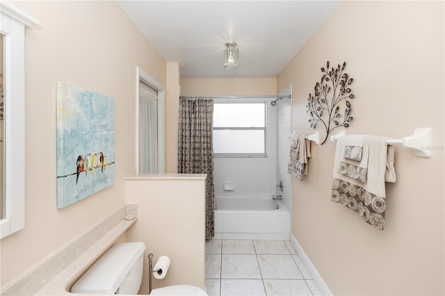 603 Yorkshire Dr, Oviedo, FL 32765 - bathroom featuring toilet, marble look tile flooring, shower / bathtub combination with curtain, and baseboards