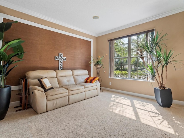 carpeted living room with ornamental molding and baseboards