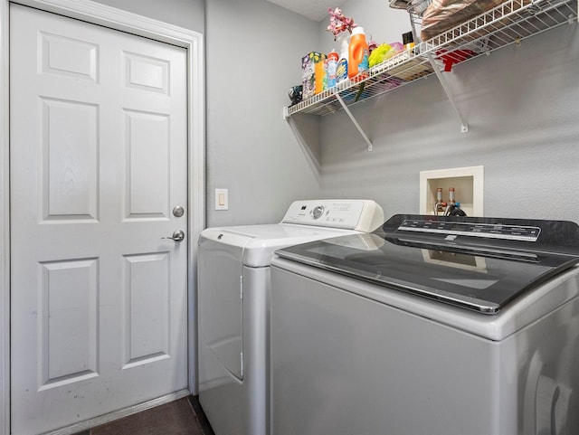 clothes washing area with laundry area and washer and dryer