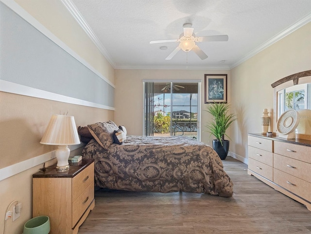 bedroom with ceiling fan, ornamental molding, access to outside, and wood finished floors