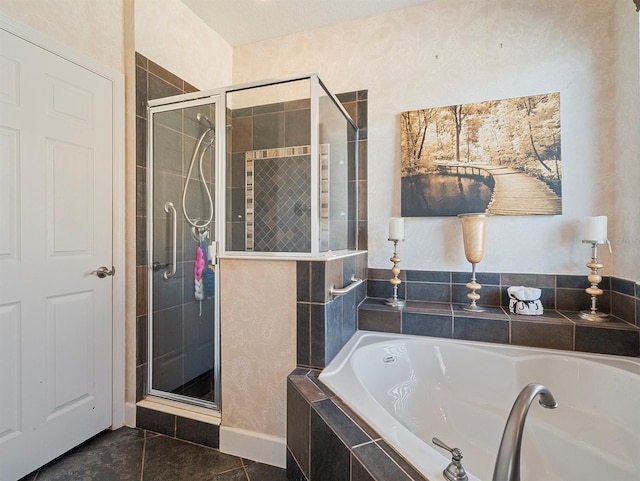 bathroom featuring a shower stall, tile patterned flooring, and a bath