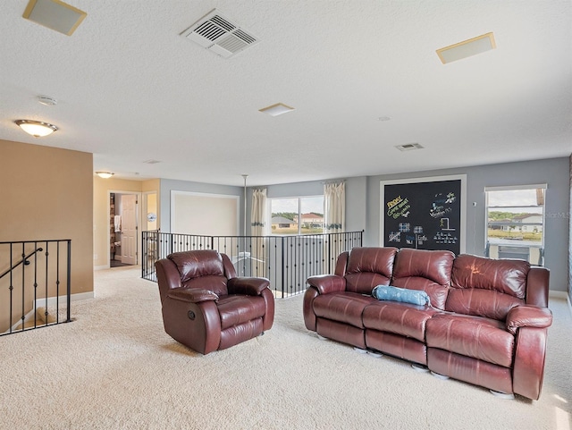 living room with carpet flooring, a wealth of natural light, and visible vents