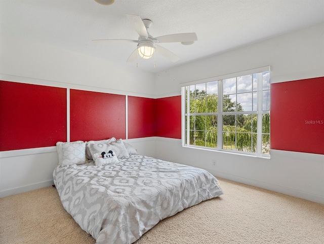 carpeted bedroom featuring a ceiling fan