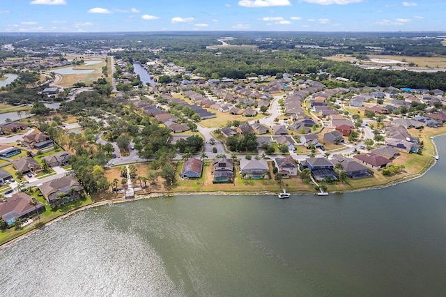 drone / aerial view featuring a water view and a residential view