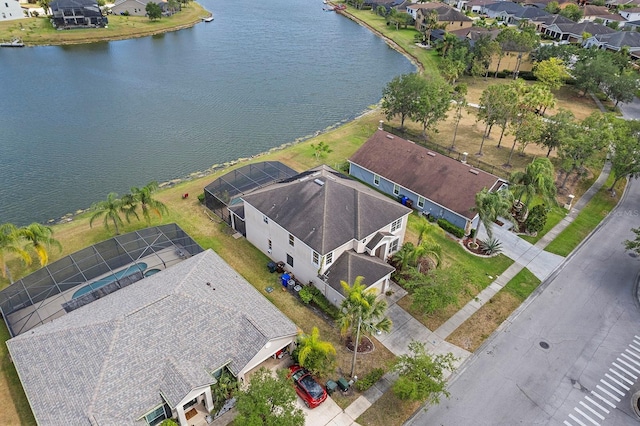 bird's eye view with a water view and a residential view