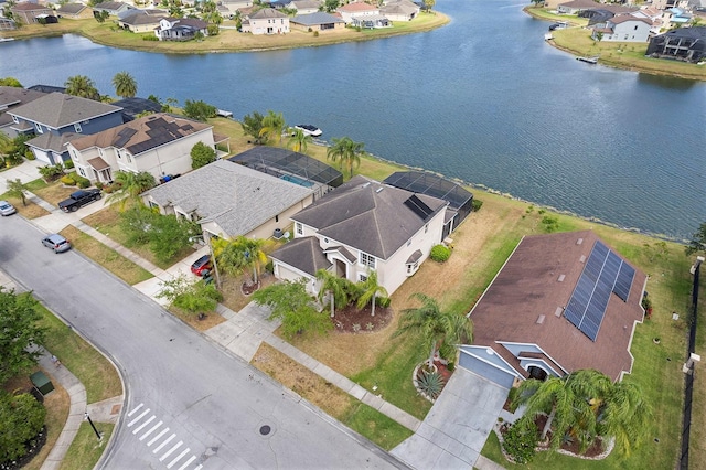 bird's eye view featuring a water view and a residential view