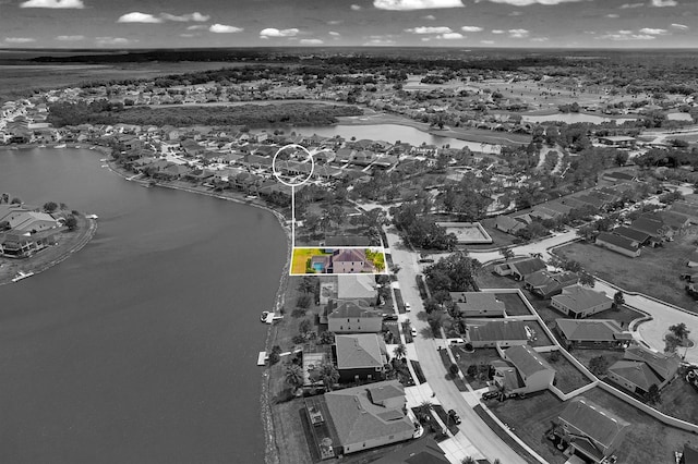 bird's eye view featuring a water view and a residential view