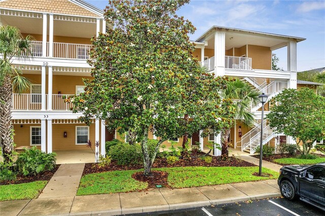 510 Rum Run Unit 33-510, Davenport, FL 33837 - view of property with stairway and uncovered parking