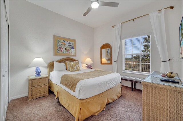 510 Rum Run Unit 33-510, Davenport, FL 33837 - carpeted bedroom featuring a ceiling fan and baseboards