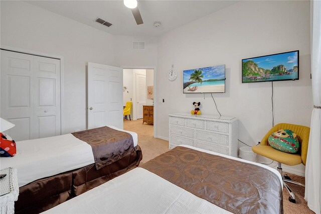 510 Rum Run Unit 33-510, Davenport, FL 33837 - bedroom featuring light colored carpet, a closet, ceiling fan, and baseboards