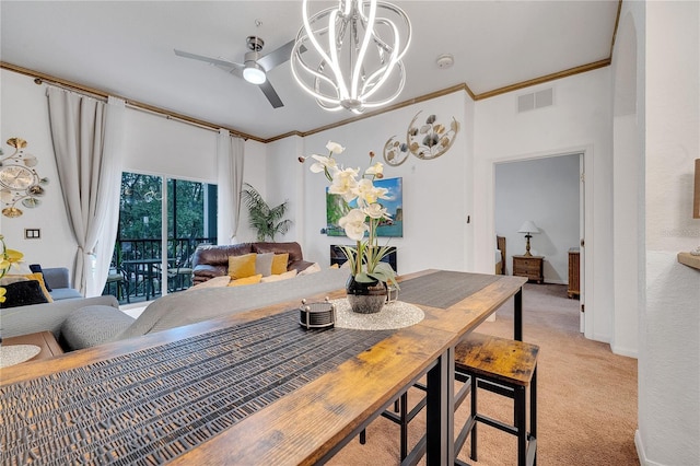510 Rum Run Unit 33-510, Davenport, FL 33837 - dining room featuring light carpet, a chandelier, crown molding, and ceiling fan