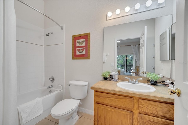 510 Rum Run Unit 33-510, Davenport, FL 33837 - ensuite bathroom with toilet, tile patterned floors, vanity, shower / bathtub combination with curtain, and baseboards