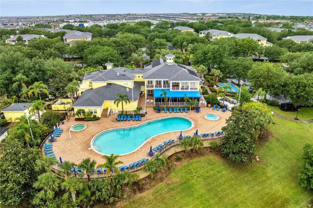 510 Rum Run Unit 33-510, Davenport, FL 33837 - community pool with a community hot tub, view of wooded area, and a patio
