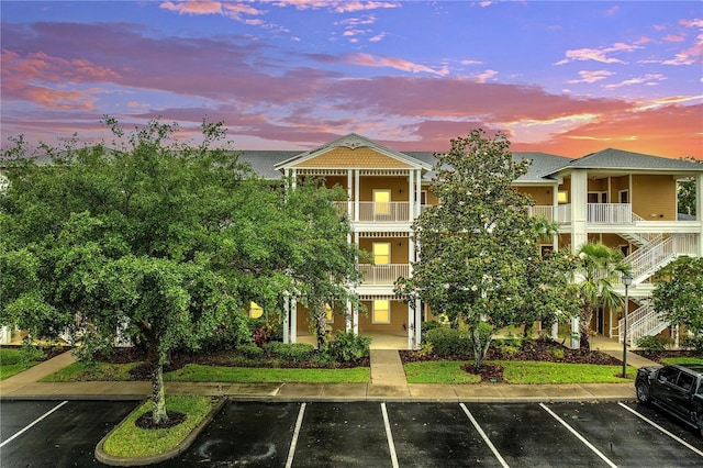 510 Rum Run Unit 33-510, Davenport, FL 33837 - property at dusk featuring uncovered parking and stairs