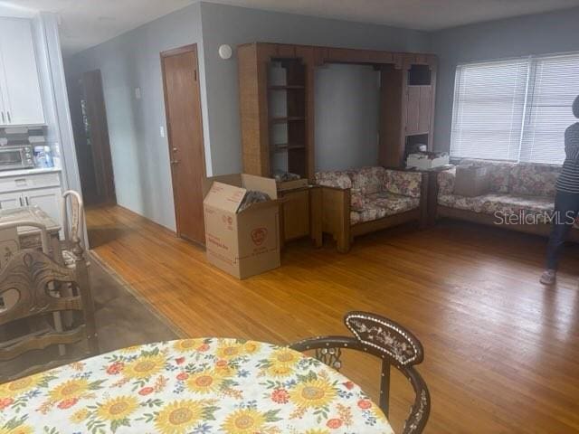 404 E Kentucky Ave, Deland, FL 32724 - living room featuring light wood-style floors