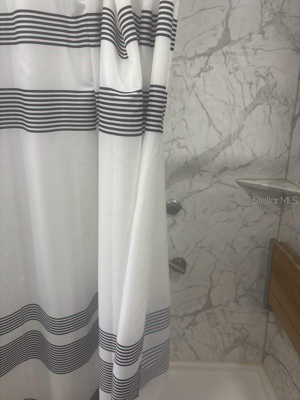 404 E Kentucky Ave, Deland, FL 32724 - bathroom featuring curtained shower
