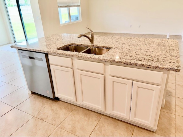 5216 Greenheart Ave, Mount Dora, FL 32757 - kitchen featuring a sink, light stone counters, light tile patterned floors, white cabinets, and stainless steel dishwasher