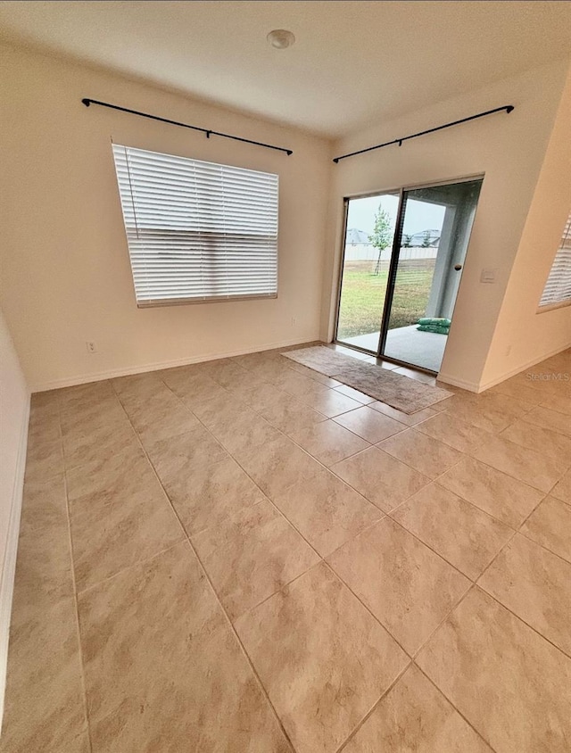 5216 Greenheart Ave, Mount Dora, FL 32757 - empty room with light tile patterned floors and baseboards