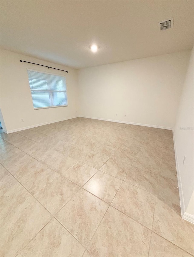 5216 Greenheart Ave, Mount Dora, FL 32757 - empty room featuring visible vents, tile patterned flooring, and baseboards