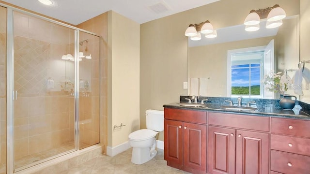 bathroom with a sink, tile patterned floors, a shower stall, and toilet