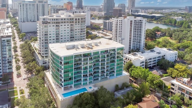 drone / aerial view featuring a water view and a city view