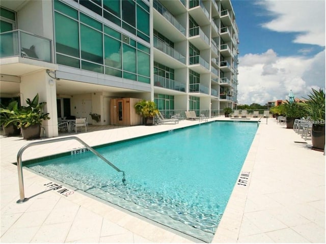 community pool with a patio