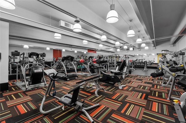 exercise room featuring visible vents