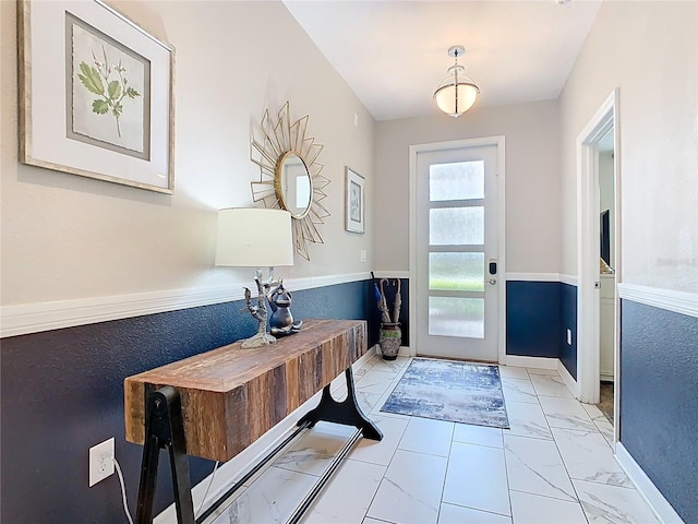 303 Ocean Course Ave, Davenport, FL 33896 - entryway with baseboards and marble finish floor