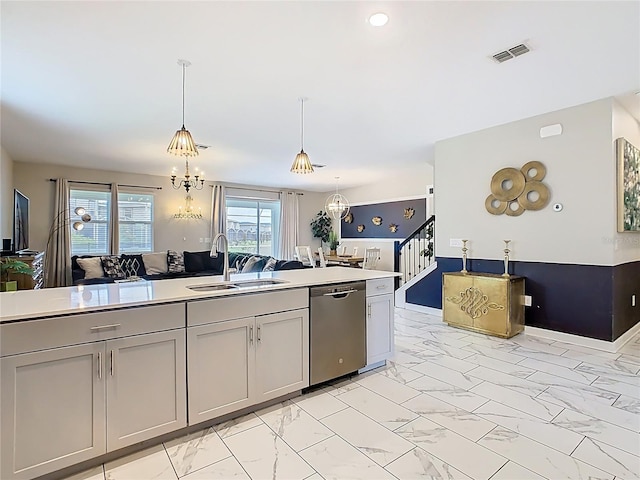 303 Ocean Course Ave, Davenport, FL 33896 - kitchen featuring stainless steel dishwasher, visible vents, marble finish floor, light countertops, and a sink
