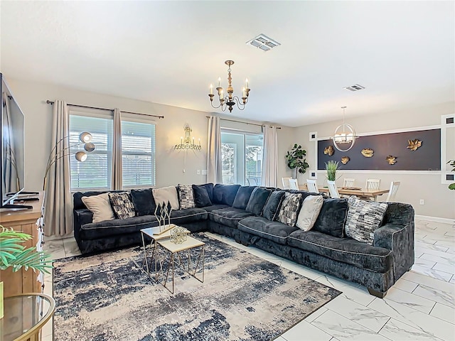303 Ocean Course Ave, Davenport, FL 33896 - living room featuring visible vents, marble finish floor, and a chandelier