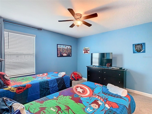 303 Ocean Course Ave, Davenport, FL 33896 - bedroom featuring baseboards, a ceiling fan, and carpet