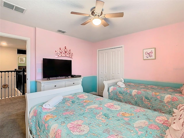 303 Ocean Course Ave, Davenport, FL 33896 - carpeted bedroom with visible vents, a ceiling fan, and a closet